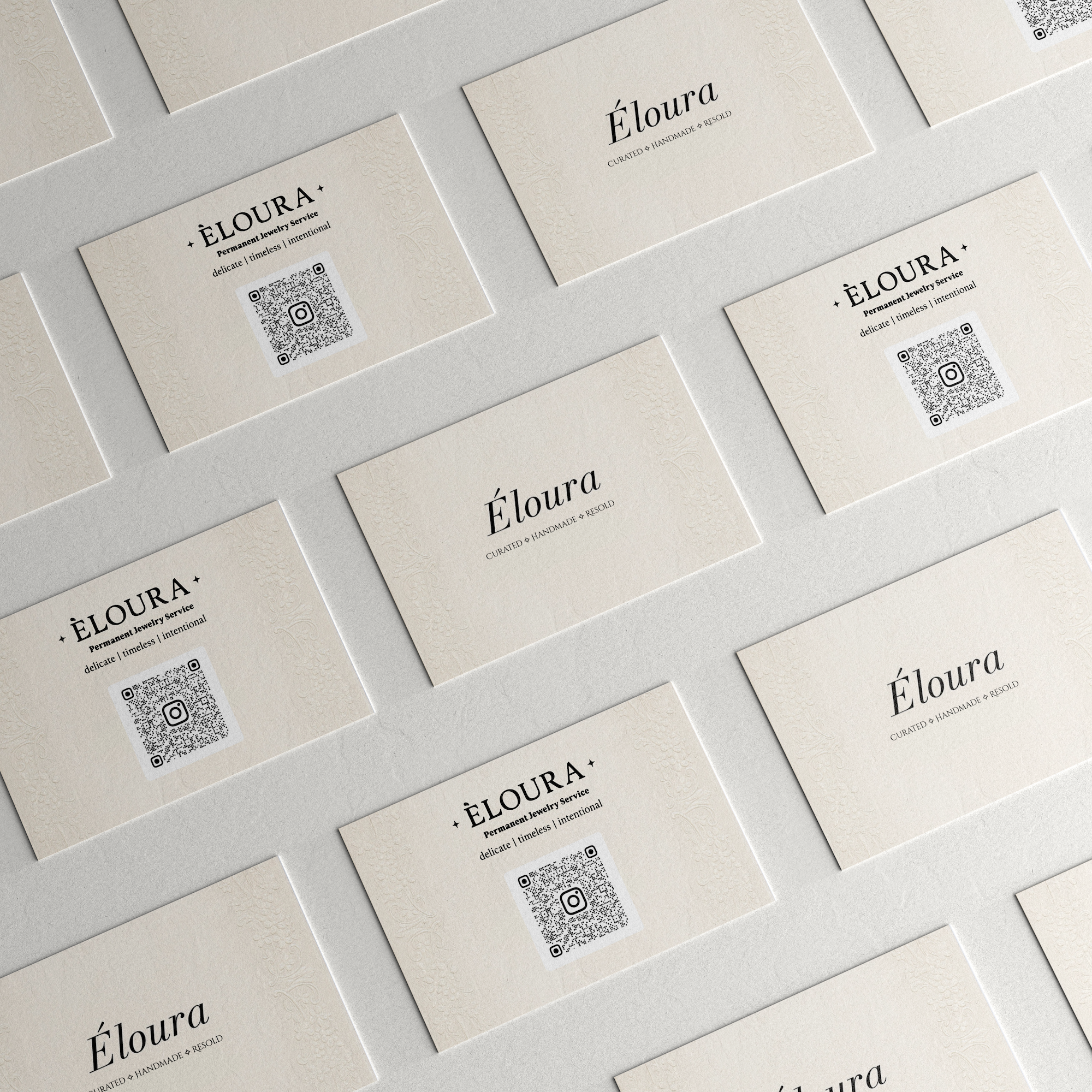 High-volume commercial printing of premium business cards with custom QR codes for Éloura Jewelry, produced by Alison's Printshop.